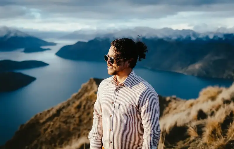 Cristian Batista entrepreneur on mountaintop overlooking Queenstown, New Zealand